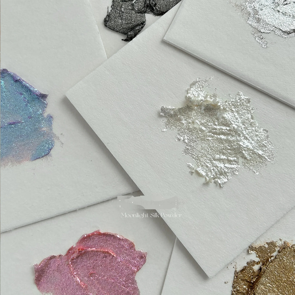 Metallic smears of YHH fairy powder paste on paper