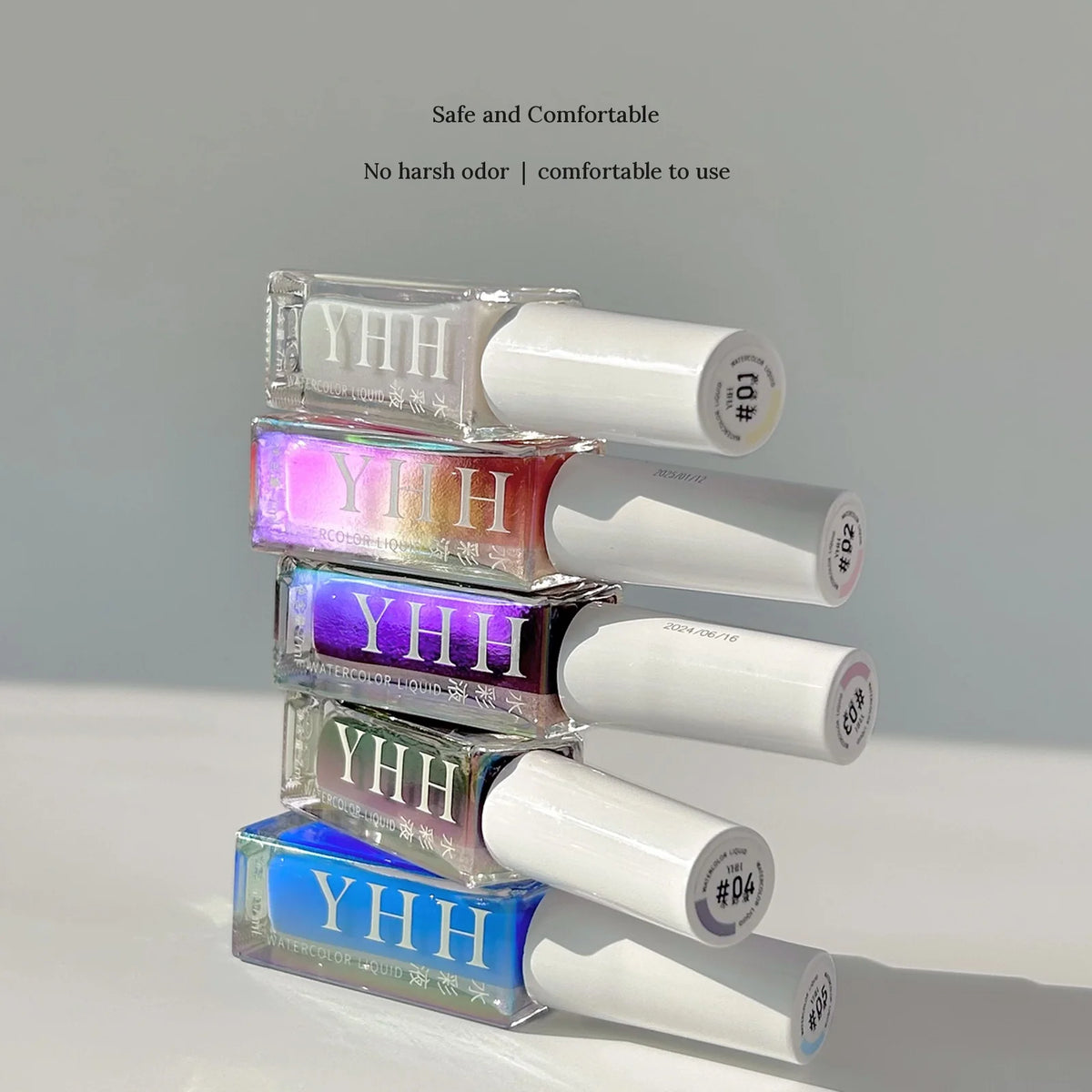 Stacked holographic bottles of YHH fairy powder watercolor ink