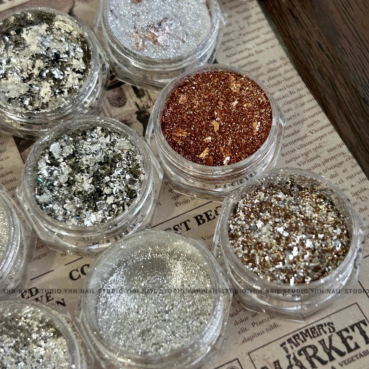 Close-up of YHH metallic foil glitter jars in gold, copper and silver
