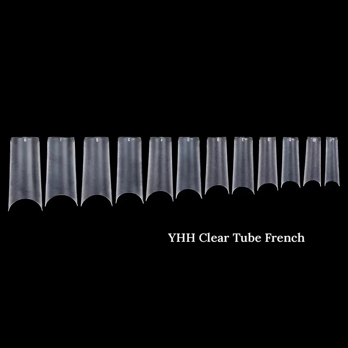 YHH clear tube French nail tips on a runner, black background