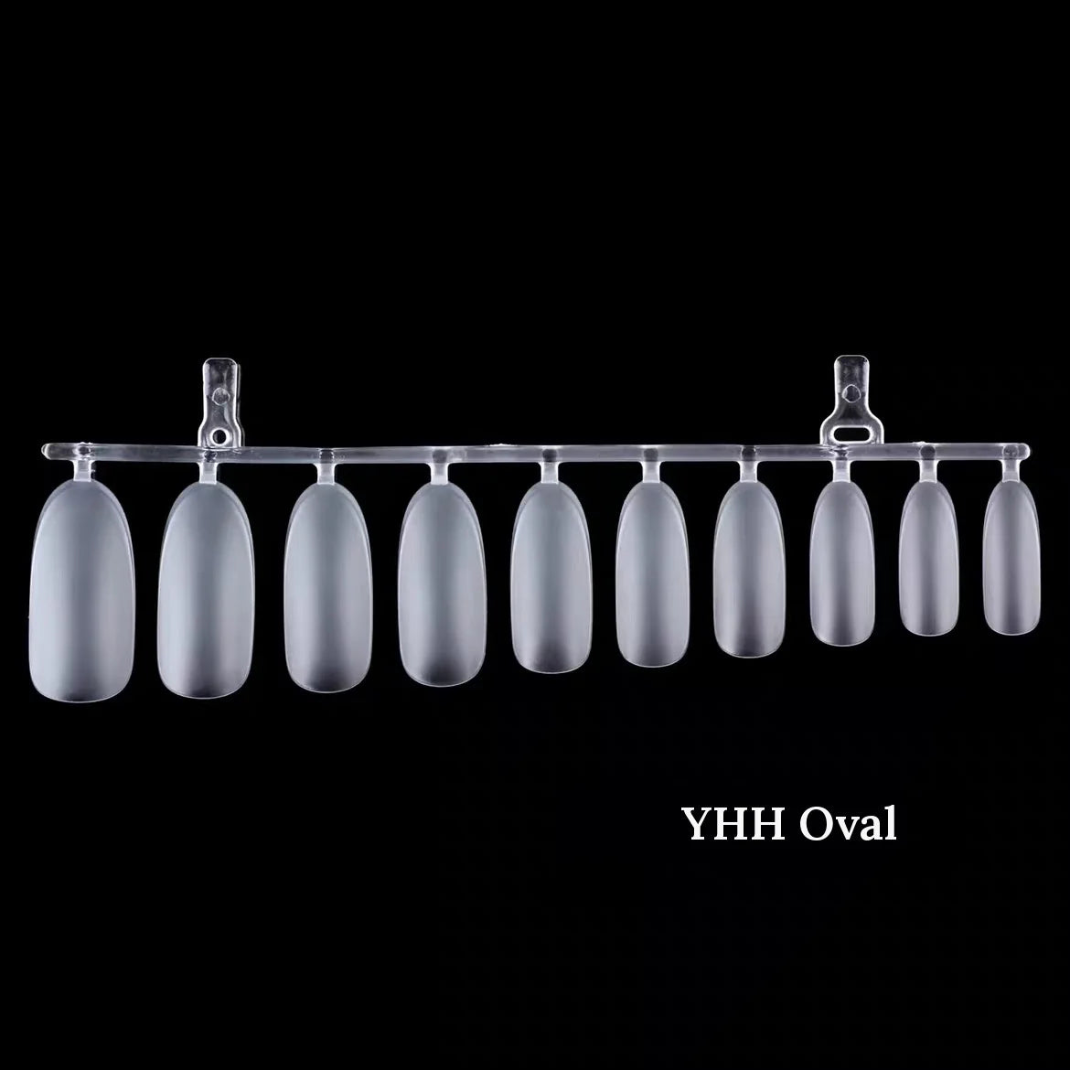 YHH frosted oval full-cover nail tips on a runner, black background