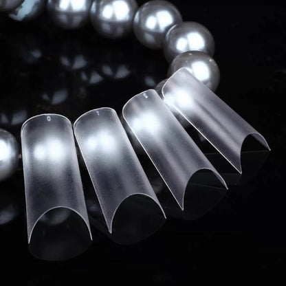 YHH frosted tube French tips fanned out beside pearls