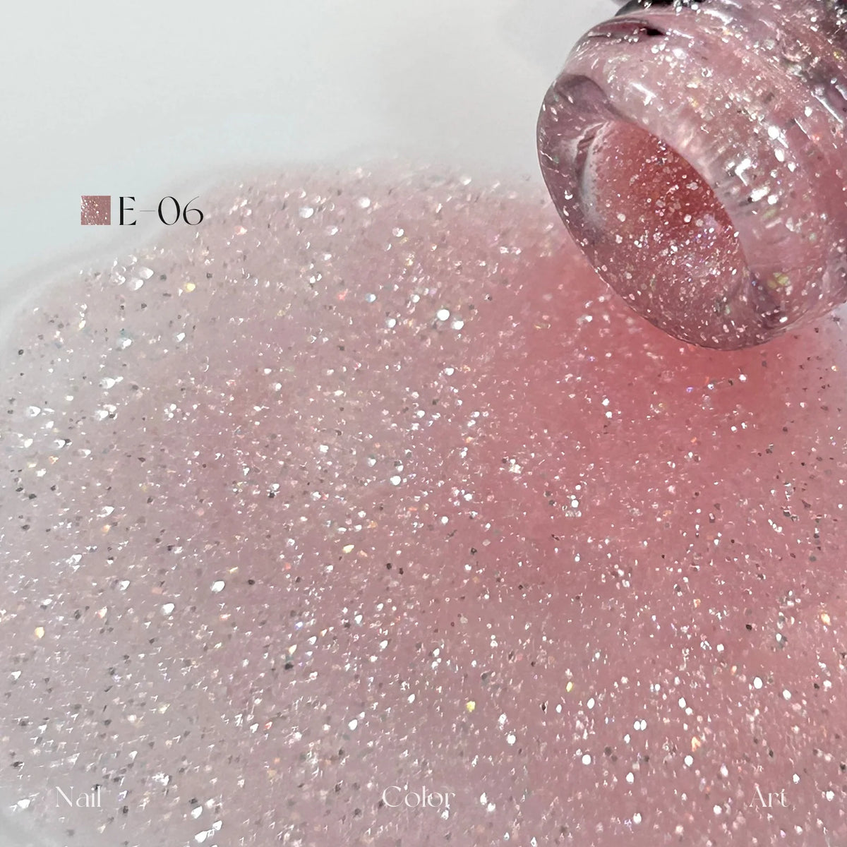 YHH Moonset Star Veil E-06 Coral Pink shimmer gel poured from the bottle