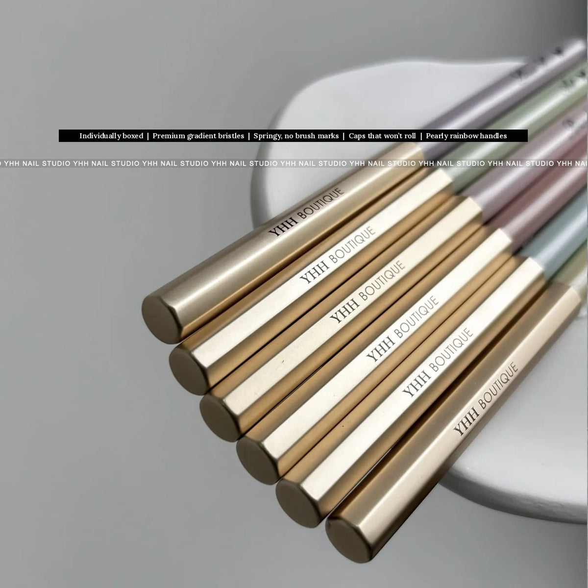 YHH Boutique hexagonal gold brush caps stacked, with English feature banner