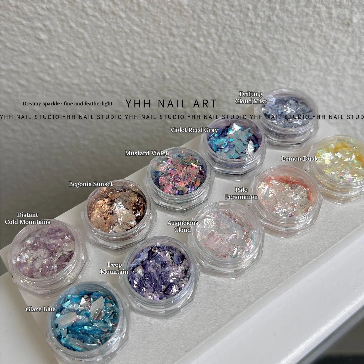 YHH Opal Powder jars on a clear tray with English shade labels