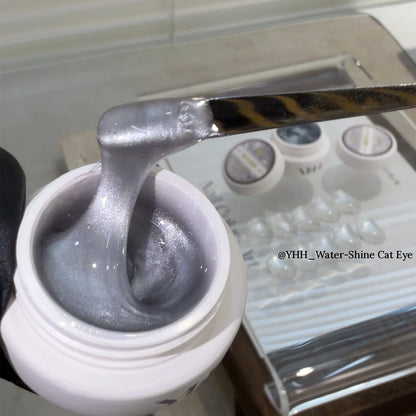 YHH Water-Shine sheer cat eye gel on a spatula over the jar